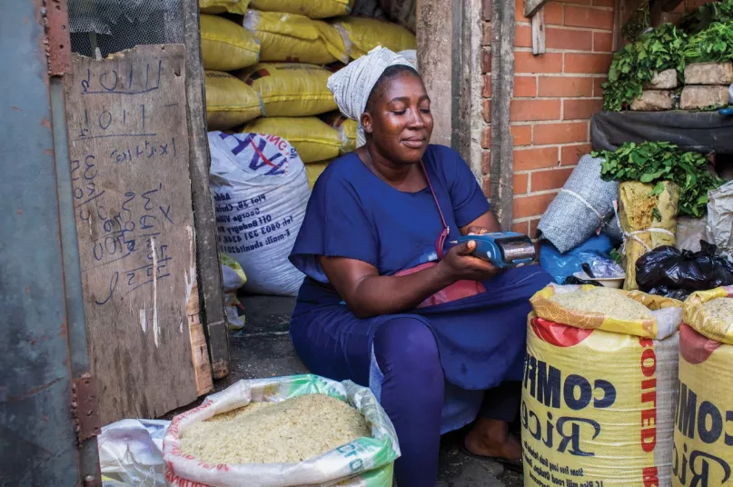 woman selling grains