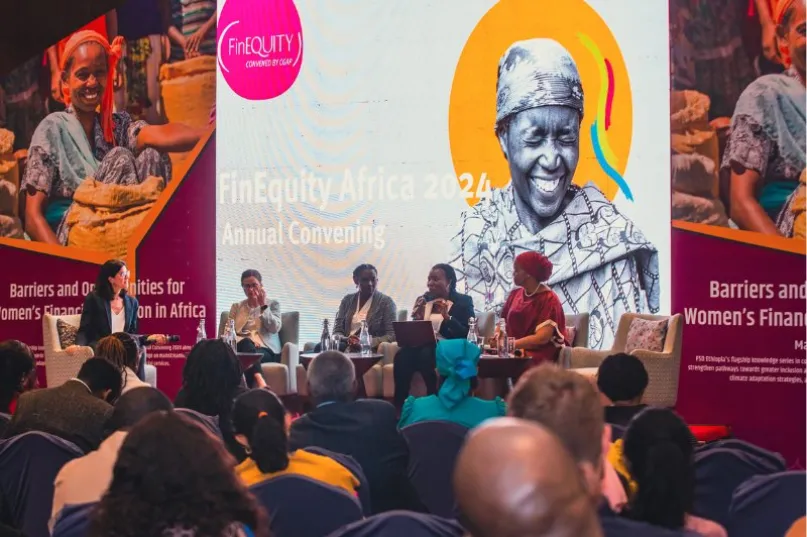 Five seated speakers facing an audience at a convention in Addis Ababa, Ethiopia.