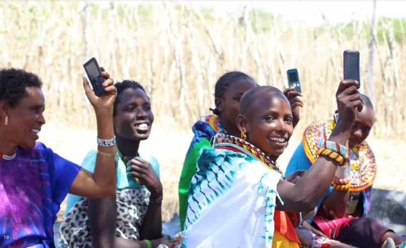 Women holding up their phones