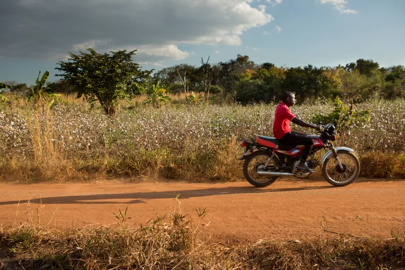 Man on motorcycle, Mozambique. Photo by Allison Shelly for CGAP.