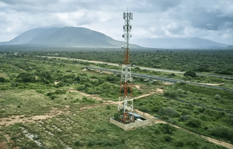 Mobile money tower in rural landscape