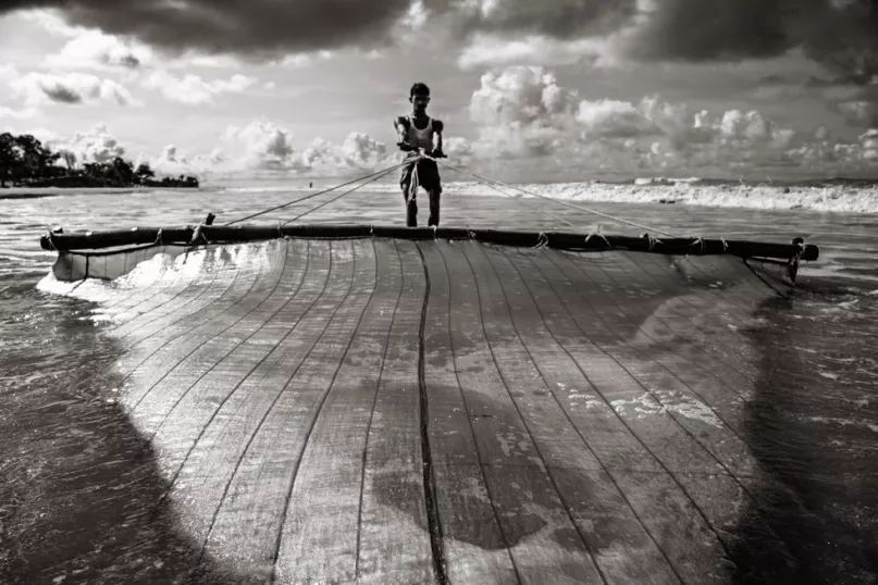 Catching Fish in the Sea. Photo credit: Belal Hossain Rana, 2015 CGAP Photo Contest.