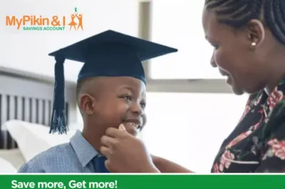 Mother with smiling child wearing graduation cap