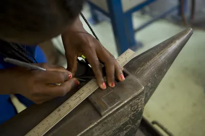 A woman working with measuring tools.