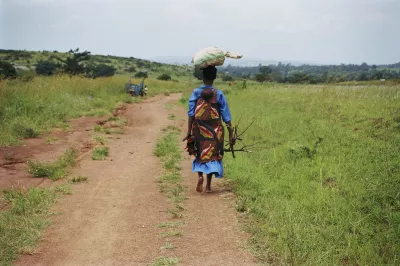 Young mother carries child on her back in rural Tanzania. Photo by Scott Wallace, World Bank.