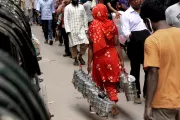 Woman carrying lunch boxes. Photo Credit: Ahmed Suhal, 2016 CGAP Photo Contest