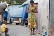 Woman with mobile phone. Photo credit: Bill and Melinda Gates Foundation 2012.