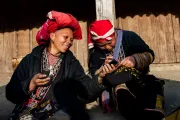 Women looking at their phone. Photo Credit: Thai Son Le, 2015 CGAP Photo Contest