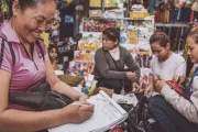 Market seller writing down orders for three customers