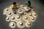 Myanmar: Two women making straw hats