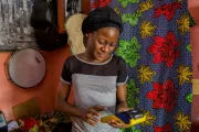 Tailor and mobile money agent, Nigeria. CGAP Photo (via Communication for Development Ltd)