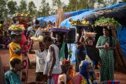 Women and children gather outside a refugee camp