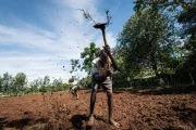 Farmer preparing land. Photo credit: Hailey Tucker, One Acre Fund.