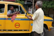 Man paying with mobile money in India. Photo Credit: Dipayan Bhar, 2015 CGAP Photo Contest