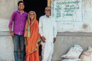 Standing outside the home they are building with the help of a microloan, India. Habitat for Humanity photo by Annalise Kaylor.