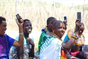 Women holding up their phones