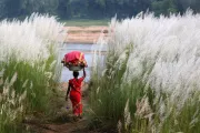 Woman walking to the river in India