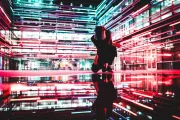 Futuristic image, neon lights surrounding person with mask.