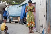 Woman with mobile phone. Photo credit: Bill & Melinda Gates Foundation 2012.