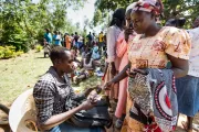 Repayment in Kasosi, Kenya. Photo by Hailey Tucker, One Acre Fund.