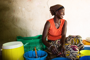 Woman separating goods into various containers